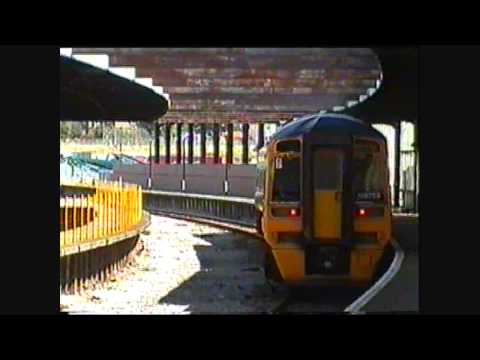 A Class 158 DMU departs Heysham Port Station 27/07/2004