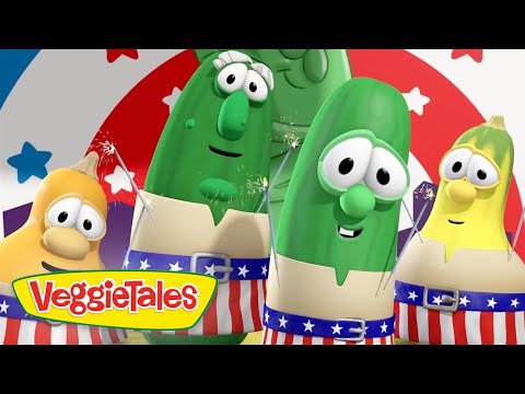 Three VeggieTales characters celebrate with fireworks and red-white-blue outfits, logo visible at bottom left.