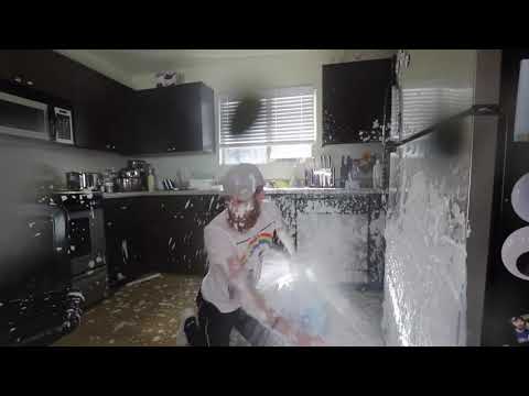 Guy spills "milk" all over his kitchen