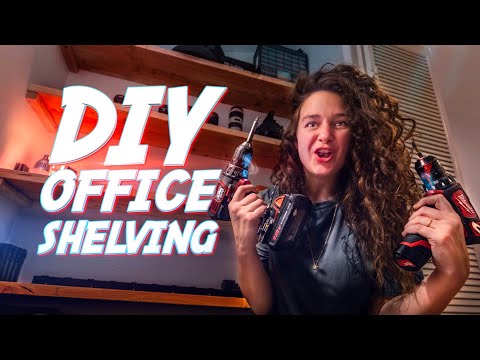 Woman in a workshop holding two cordless drills with bold 'DIY Office Shelving' text overlay on the screen, promoting a DIY tutorial