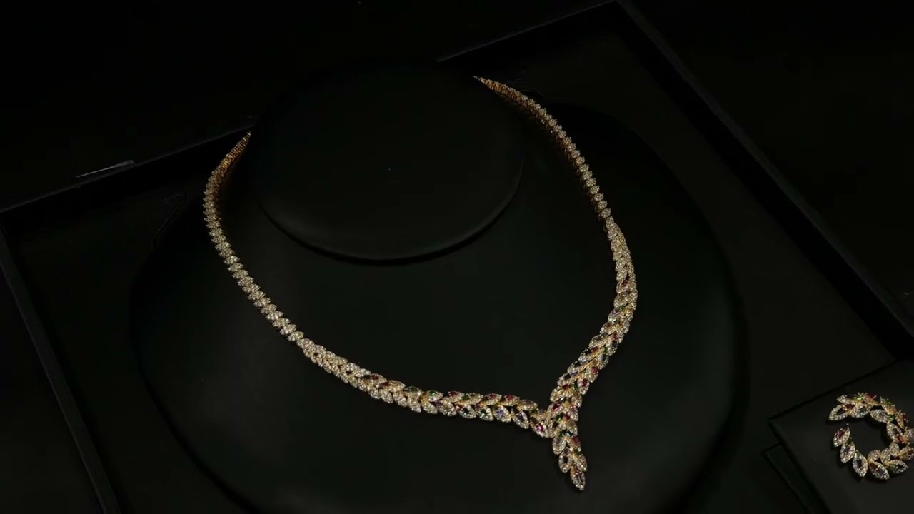 Gold accessory set studded with colored stones