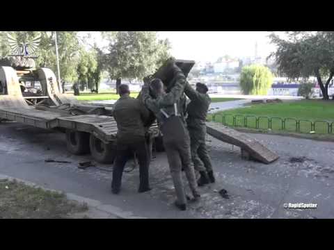 Rolling down M84 tank from tank transporter trailer