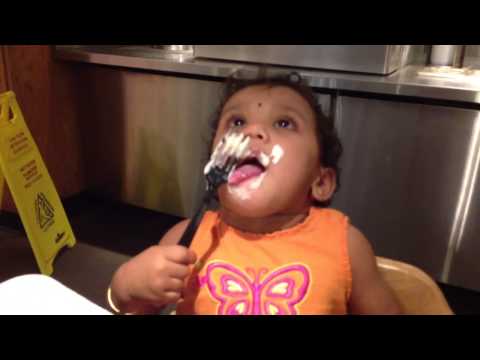 Taruni yogurt by herself with fork @ 11 months