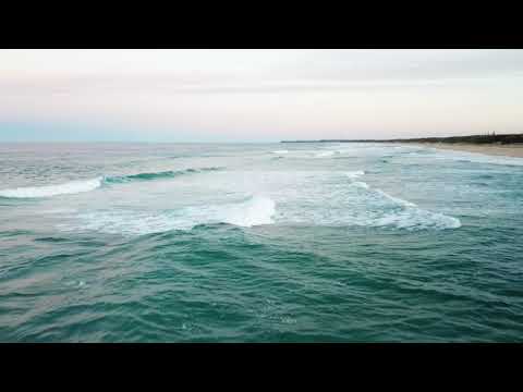 Aerial shots of surf breaking at Kawana