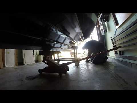 How to remove a boat from the trailer on land