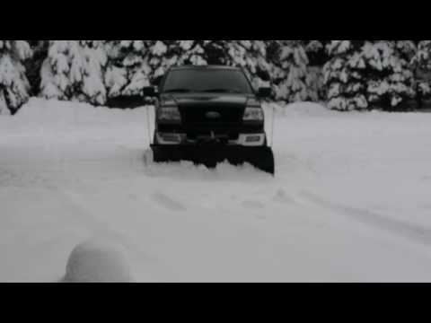 Plowing the driveway with the Meyer snow plow 26000