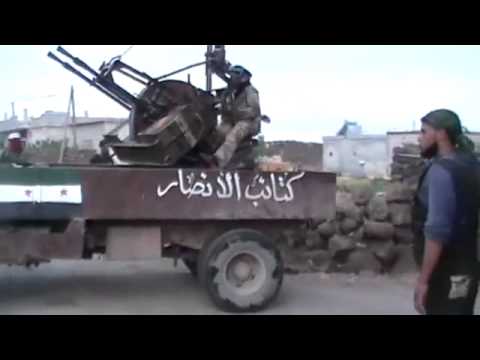 كتائب الأنصار تقوم بالتجهيز لضرب أحد حواجز قرية عين ذكر بالاسلحة الثقيلة في نوى في ريف درعا