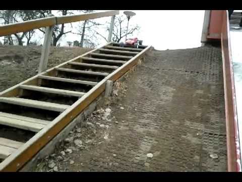 thunder tiger rc car running down a flight of stairs