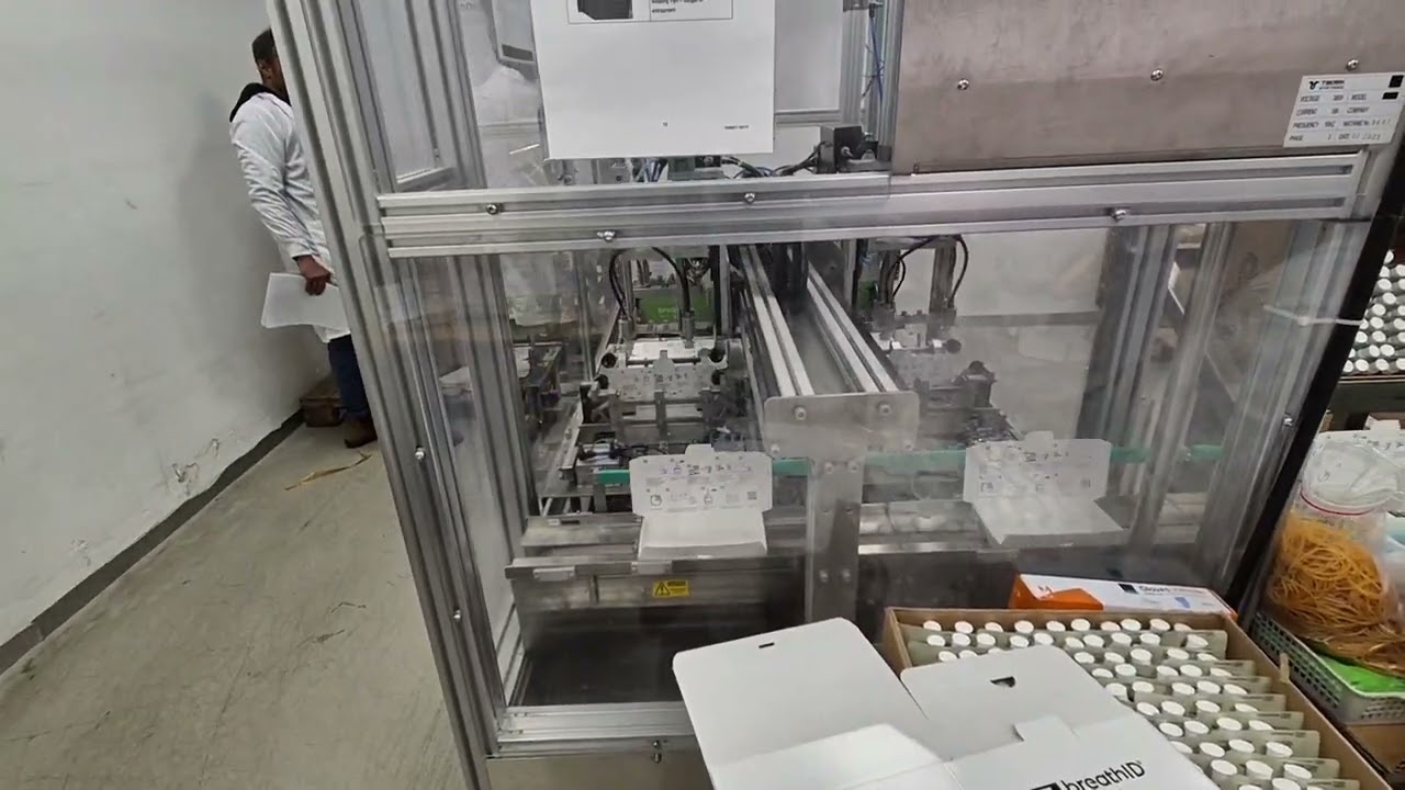 Packaging line for medical kit includes case erector and elements feeding