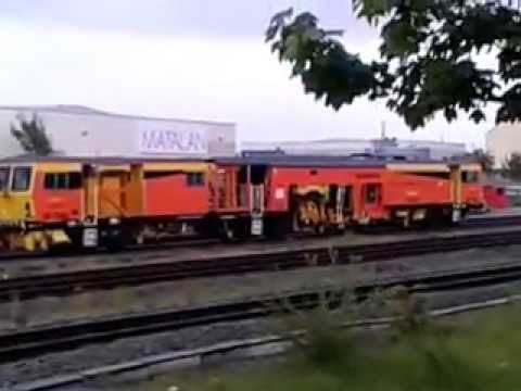Rhyl 29.5.2013 - Colas Rail Tamper DR73942 joins NR Stoneblower