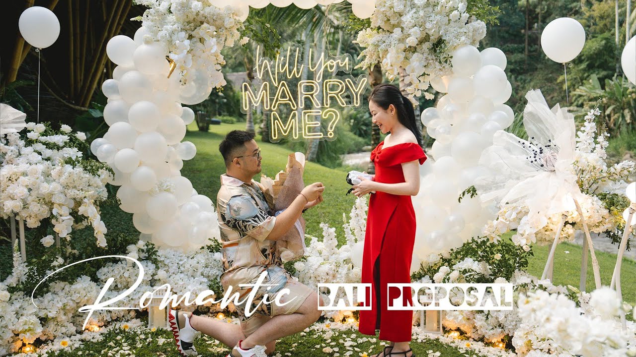Video thumbnail: romantic proposal with a balloon arch and Will You Marry Me neon sign