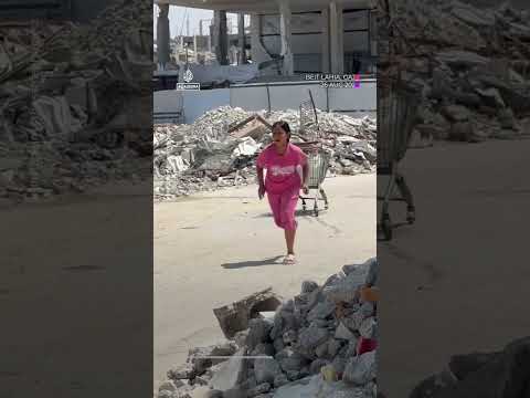 Children take cover behind shopping cart during Israeli drone fire | AJ #shorts