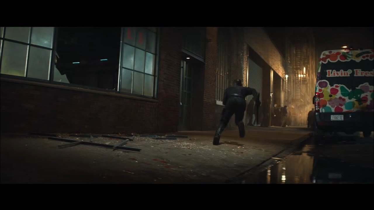 Someone says Uatu The Watcher is shown on the left in the broken window X Daredevil Born Again S2E4