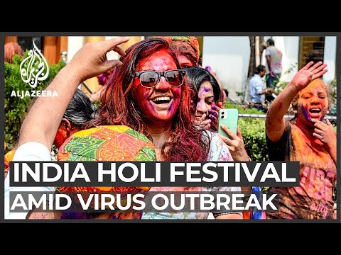 インドのホーリ祭：祝賀会はウイルスの流行によって影を落としている (India Holi festival: Celebrations overshadowed by virus outbreak)