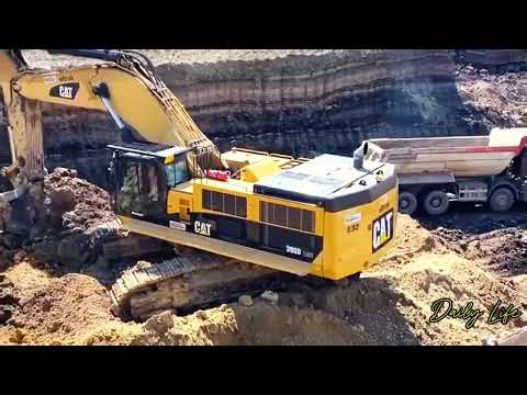 Cat Eltrak excavator loads soil onto dump truck at construction site #excavator #truck #hitachi
