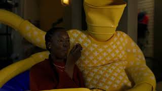  Woman sitting eating macaroni and cheese