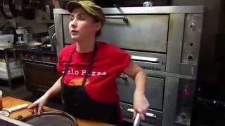 Chelsea Removes A Gourmet Zelo Pizza From The Oven