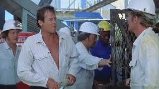 Download lagu 1974 - Gold - Roger Moore - Can one man stop a billion-dollar disaster? mp3 Download lagu 1974 - Gold - Roger Moore - Can one man stop a billion-dollar disaster? mp3