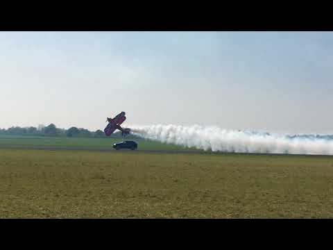 Rich goodwin Pitts biplane racing a Jag at Abingdon
