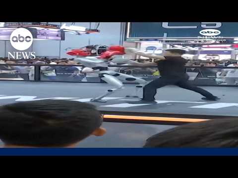 Man spars robot boxer at Chinese tech conference