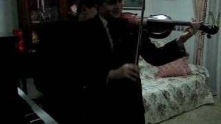Josiah Catchpole playing the violin with the help of his brother