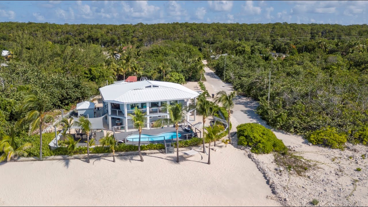 A wave from it all - Cayman Brac Oceanfront stunner