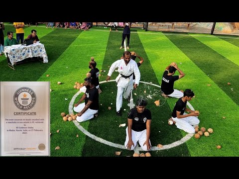​Most coconuts on heads smashed with a nunchaku in one minute- WORLD RECORD.