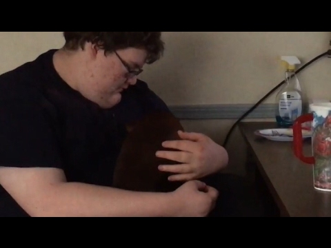 Fat man hugs tiny wiener