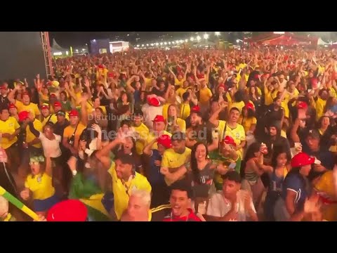 Brazilian fans celebrate Brazil's 3-0 victory over Haiti at the World Cup