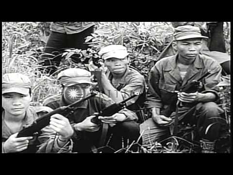 United States soldiers train montagnards in Vietnam about the use of weapons duri...HD Stock Footage