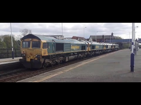 Freightliner class 66 convoy passing Church Fenton (19/4/22)