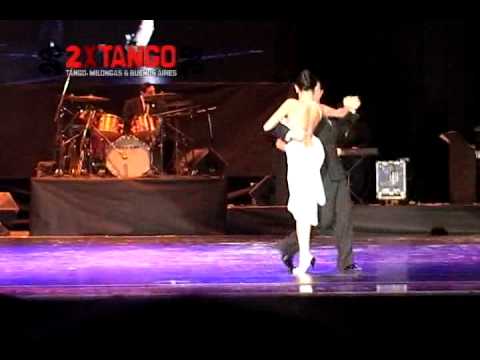  Miguel Angel Zotto  and  Daiana Guspero  are  dancing  to  the  tango  "  La Cumparsita  "