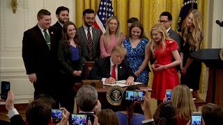 Video thumbnail for, "Campus Free Speech." Donald Trump signs a document at the White House.