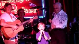 7 year old boy singing on stage with George Jones - Louisiana Saturday Night and White Lightning