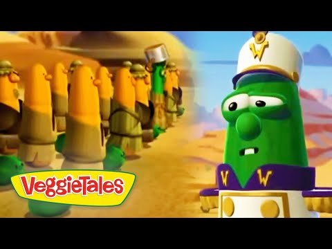 Green VeggieTales character in a captain’s hat faces a line of yellow-armored soldiers in a desert setting; VeggieTales logo bottom left.