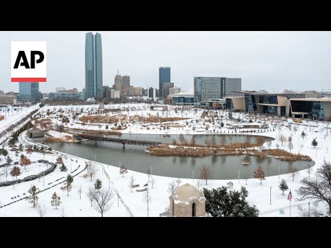 Aerial video shows a snow-covered Oklahoma City
