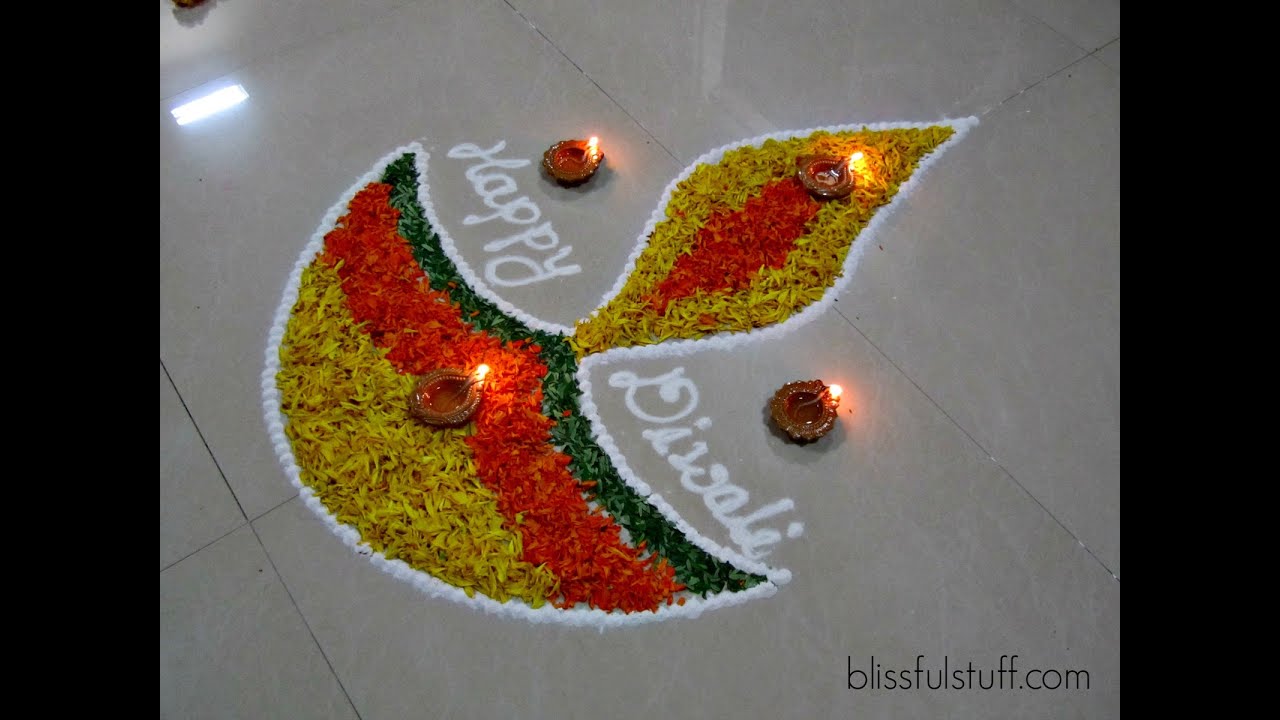 Diya rangoli design with marigold flowers by poonam borkar