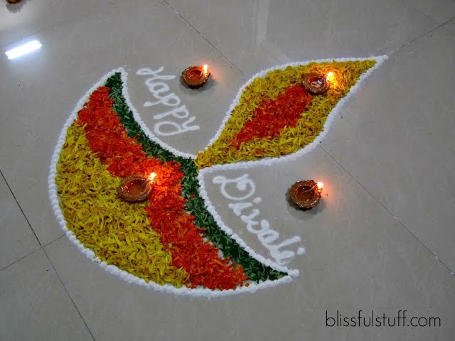 Diya rangoli design with marigold flowers by poonam borkar