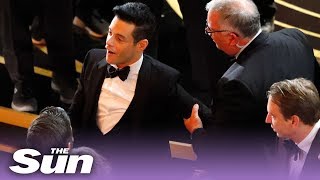 Oscars 2019: Rami Malek falls off stage (video)