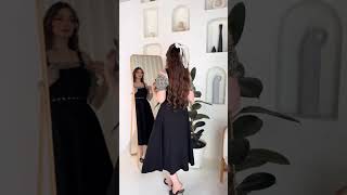 فستان ميدي أسود وأكمام كاروهات