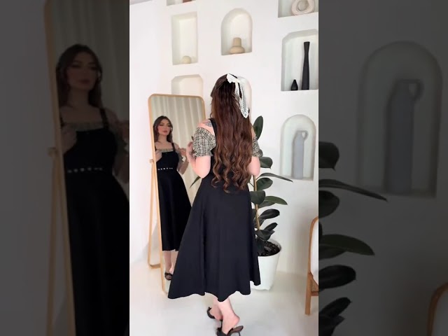 فستان ميدي أسود وأكمام كاروهات