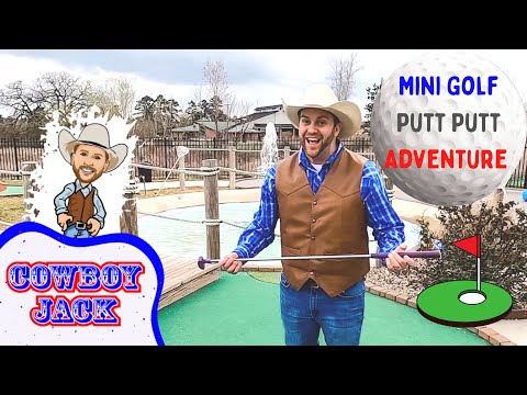 Man in a cowboy hat and brown vest holds a putter on a mini-golf course, with a cartoon cowboy cutout and 'Cowboy Jack' sign in the scene.