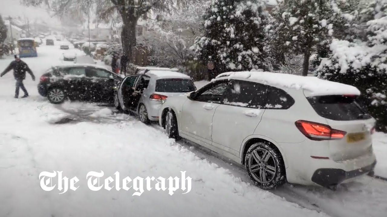 Watch Cars and buses slide down hill and collide in snow Flipboard