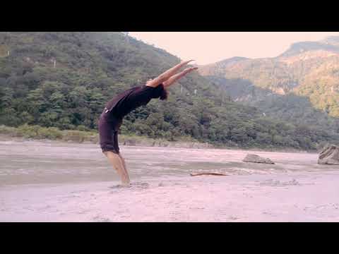 Standing Chakrasana at Goa Beach in Rishikesh .