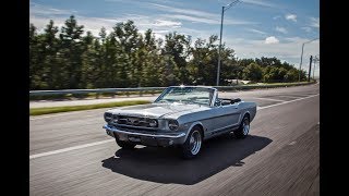 1966 Ford Mustang GT Convertible by Revology Cars Factory Overview. A 1966 Revology Mustang GT convertible in Silver Frost Metallic with custom Gray Porsche Nappa leather.