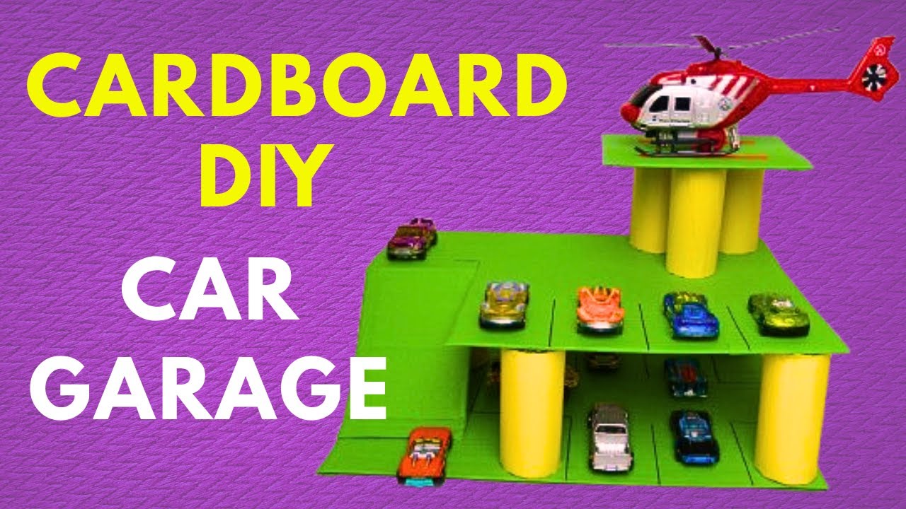 Parking for cars made of cardboard and toilet paper rolls. DIY children