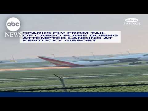 Sparks fly from tail of cargo plane during attempted landing