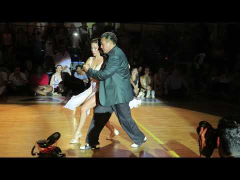  Juana Sepulveda  and  Mariano Frumboli  are  dancing  to  the  tango  "  Quiero Verte Una Vez Mas  "  at  A los amigos tango festival  in  2019