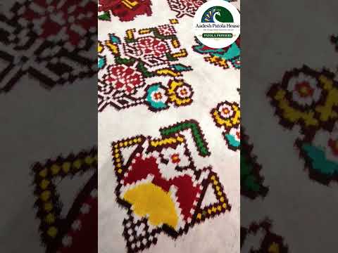 Red Triful border and White Figure Double ikat Patola Saree