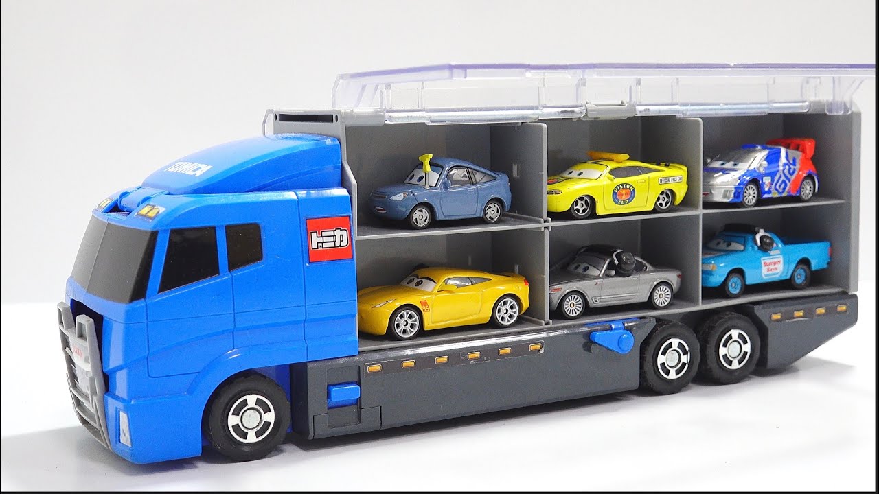 A blue storage truck is loaded with 12 Cars model cars.
